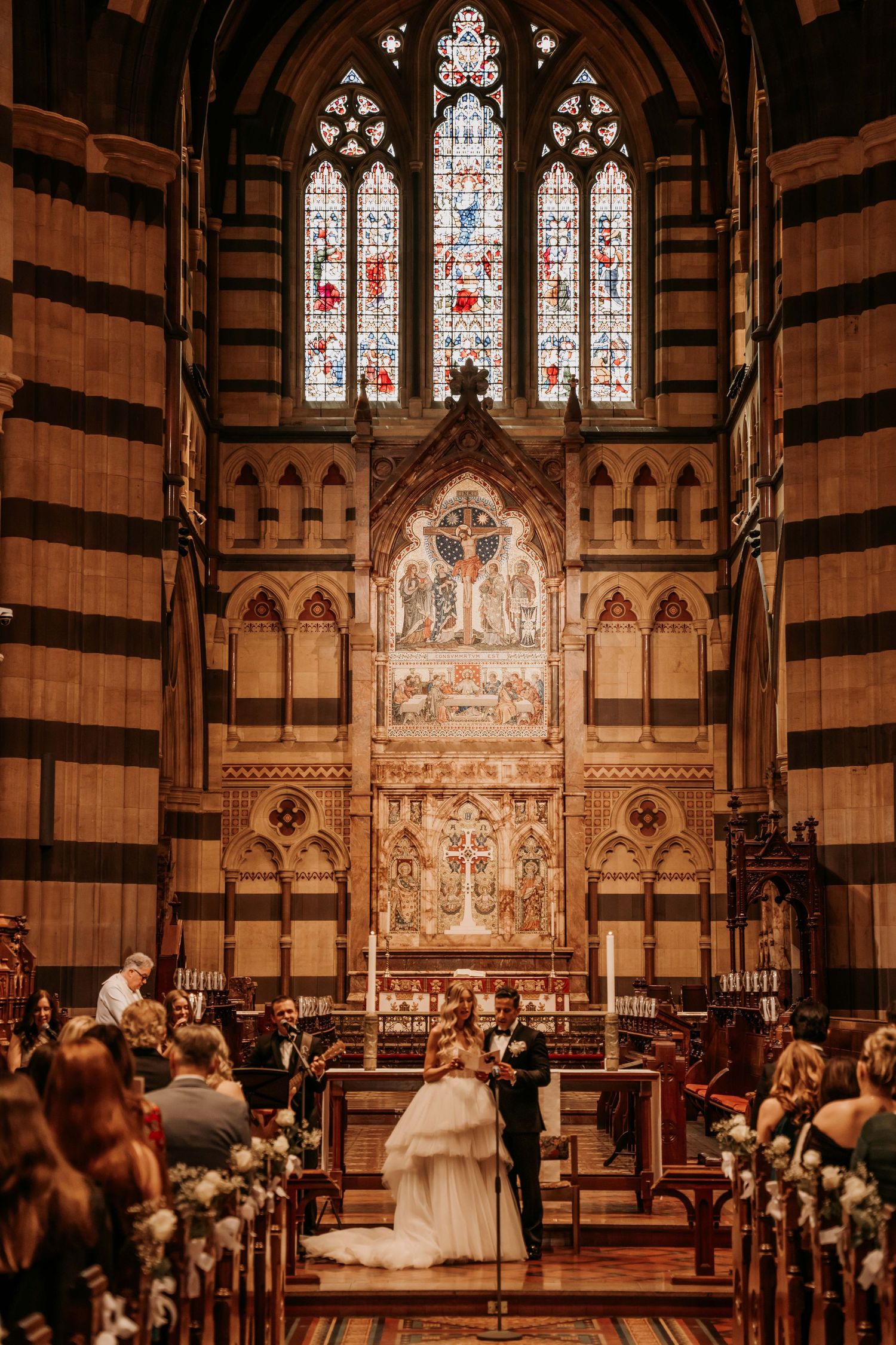 Panoramic sequence of a traditional church wedding ceremony showing stained glass windows and Gothic architecture.