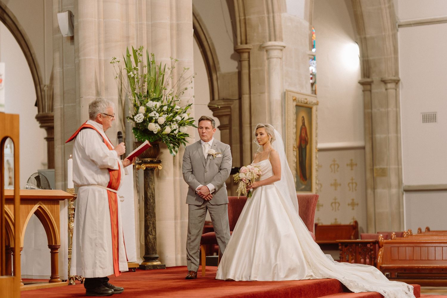 A sequence of wedding ceremony photos showing a bride and groom kneeling at the church altar during their marriage service.