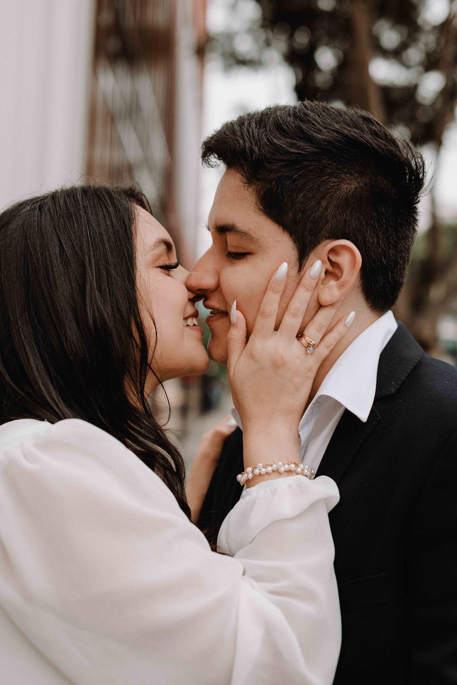 Series of intimate close-up shots showing a tender kiss between newlyweds.