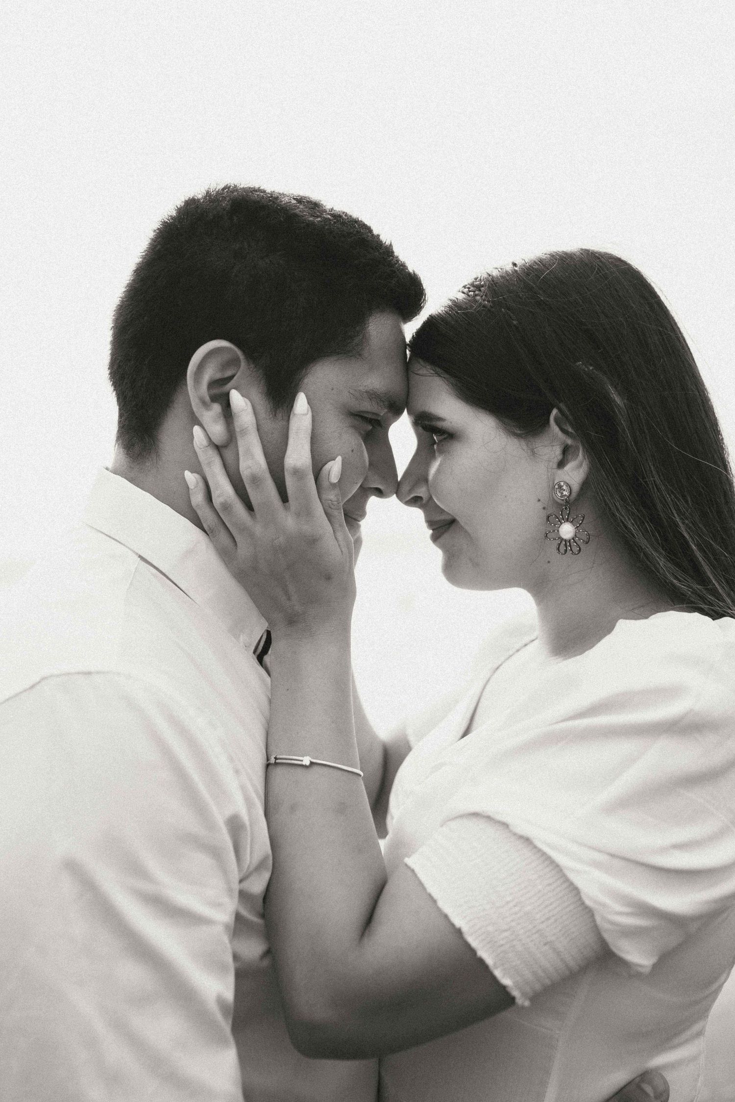 Black and white sequence capturing intimate moments between a couple during their wedding photoshoot.