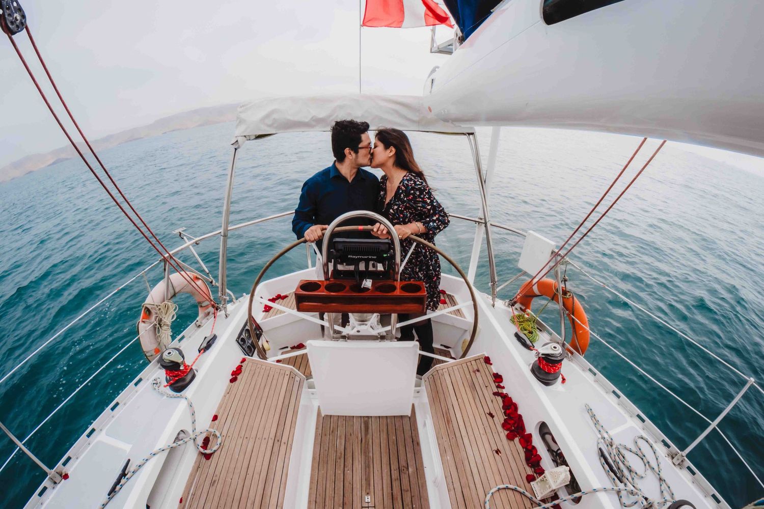 A series of images showing a sailboat deck with wooden flooring and sailing equipment at sea.