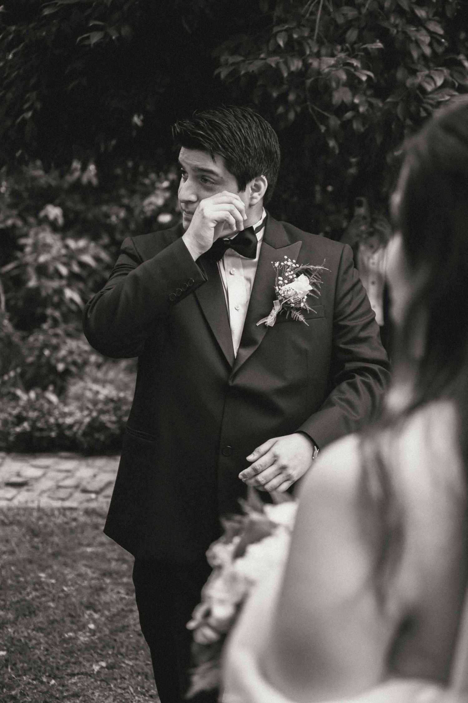 Black and white wedding portraits showing intimate moments between the couple.