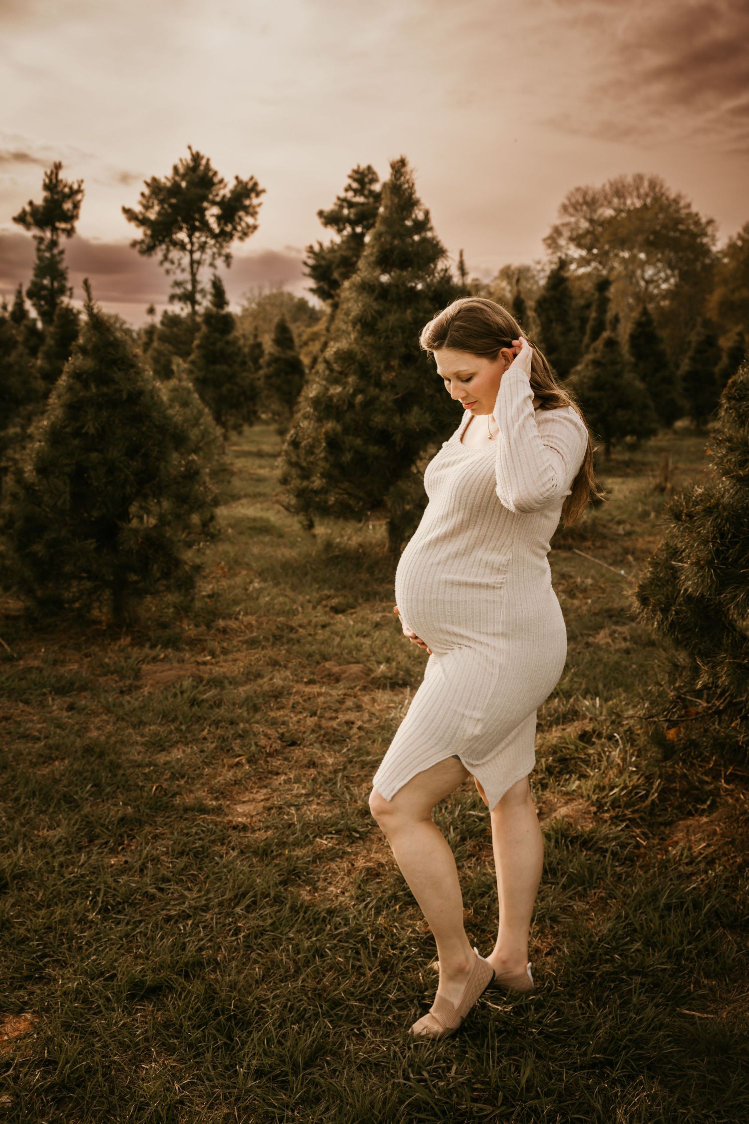 A sepia-toned triptych shows a figure in a white sweater dress dancing expressively in a natural outdoor setting.
