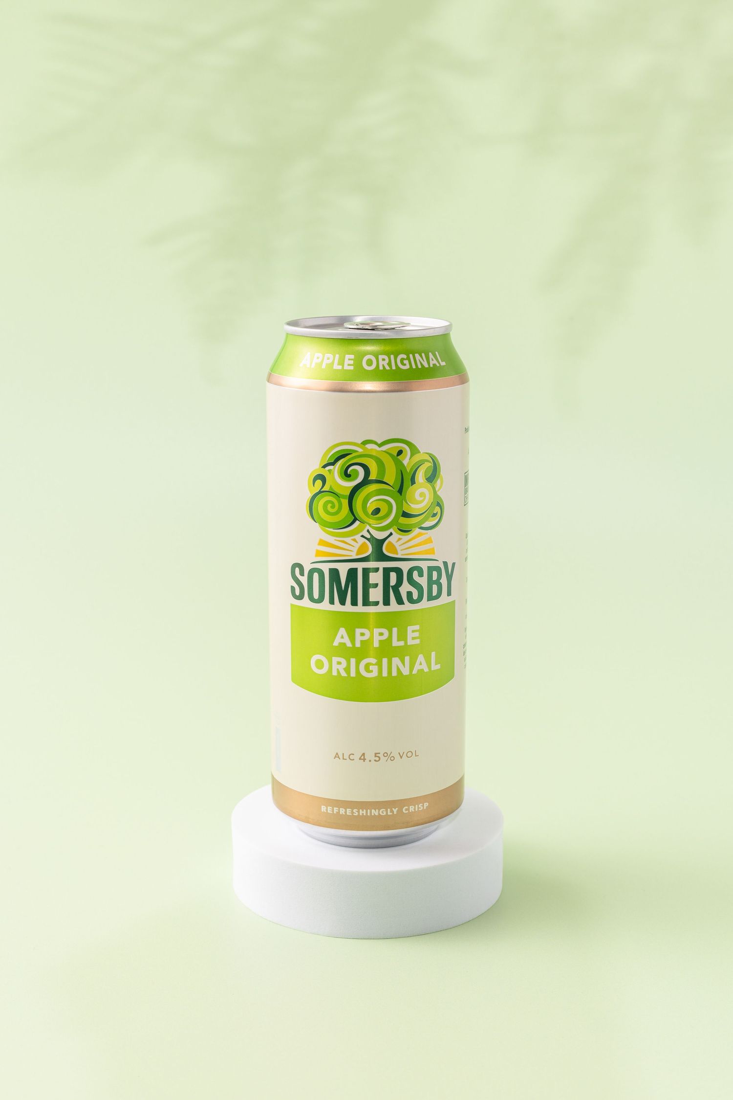 Four identical cans of Somersby Apple Original cider shown from different angles on a light green background.