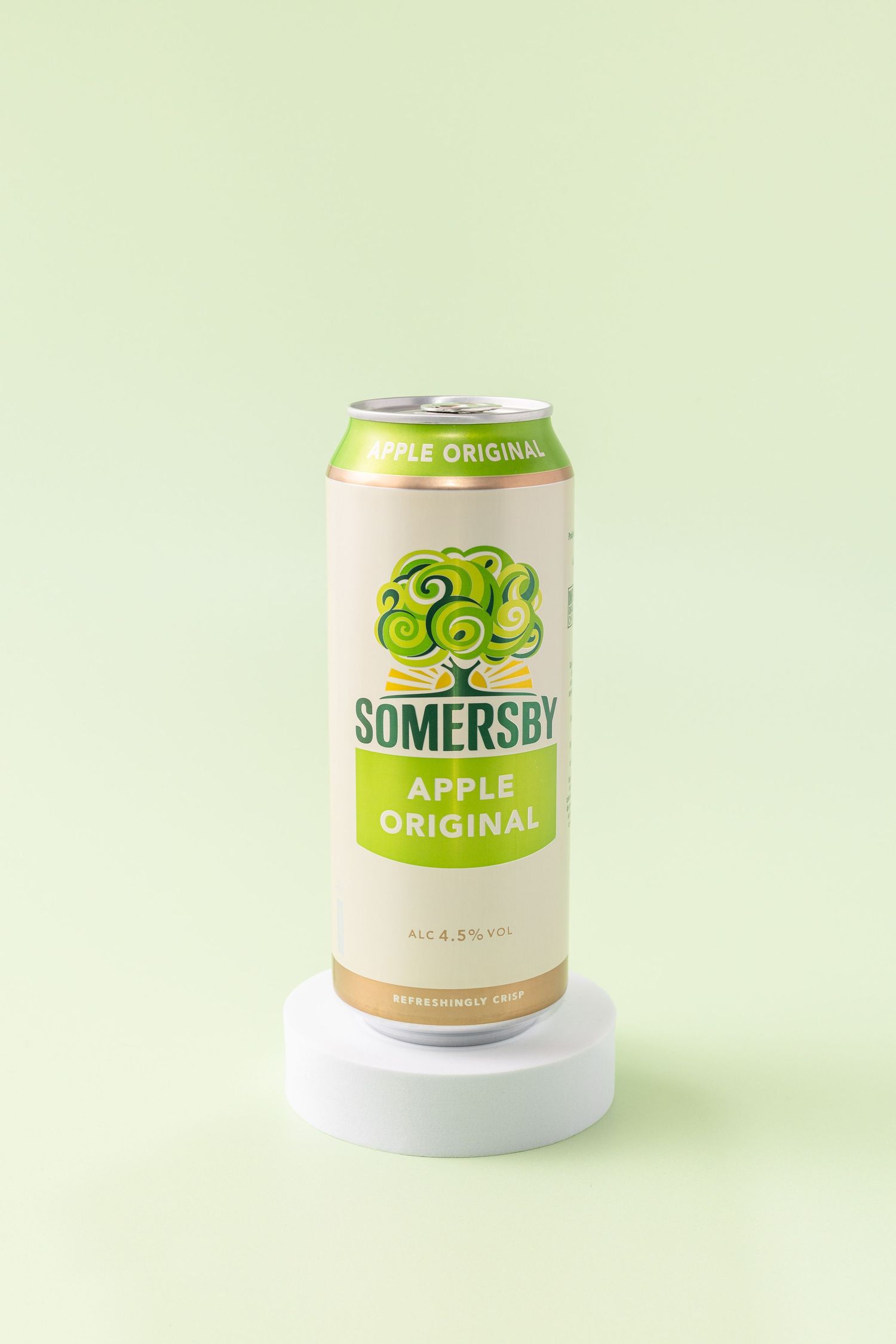 A can of Somersby Apple Original cider on a white pedestal against a light green background.