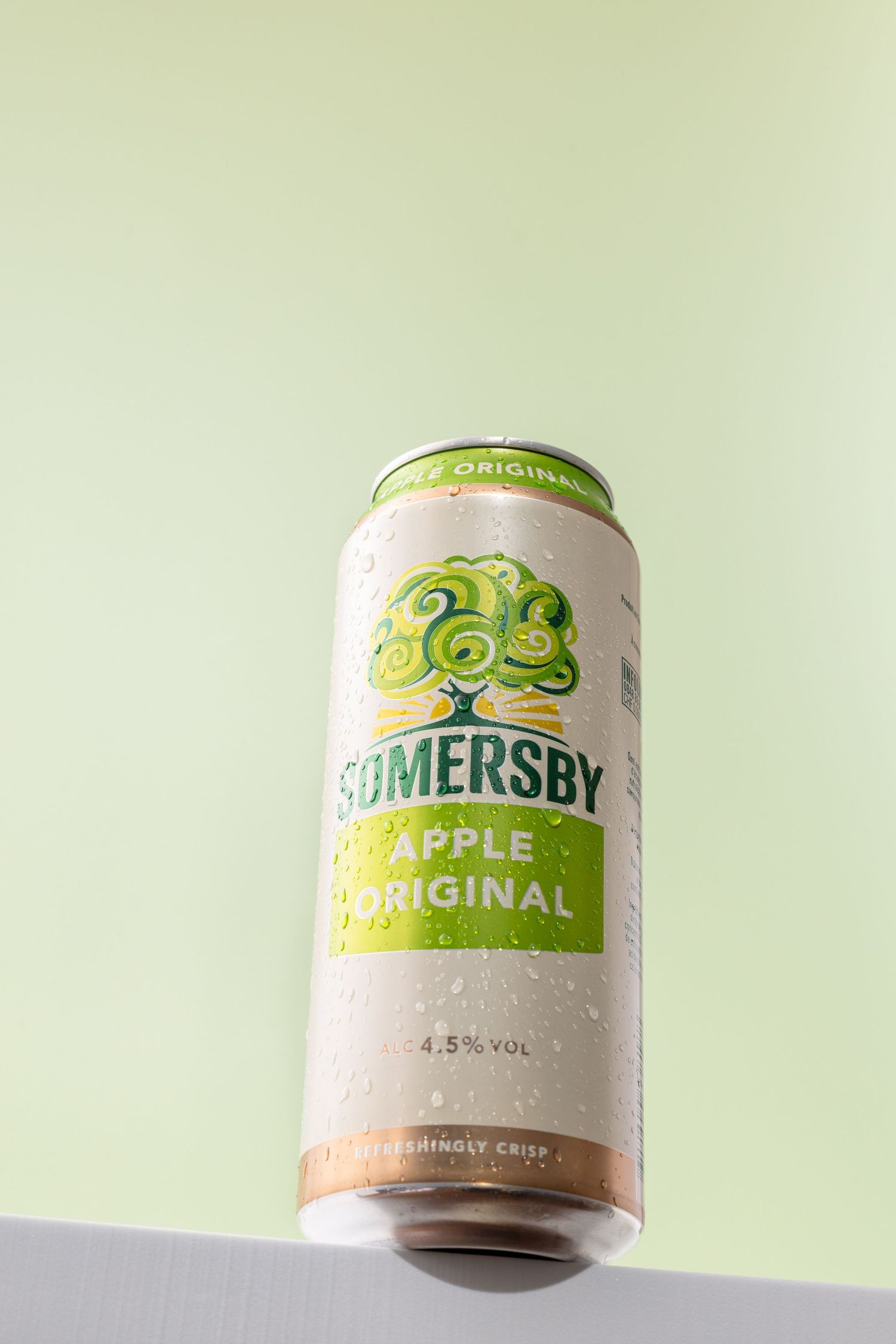 Three cans of Somersby apple cider shown from different angles against a light background.
