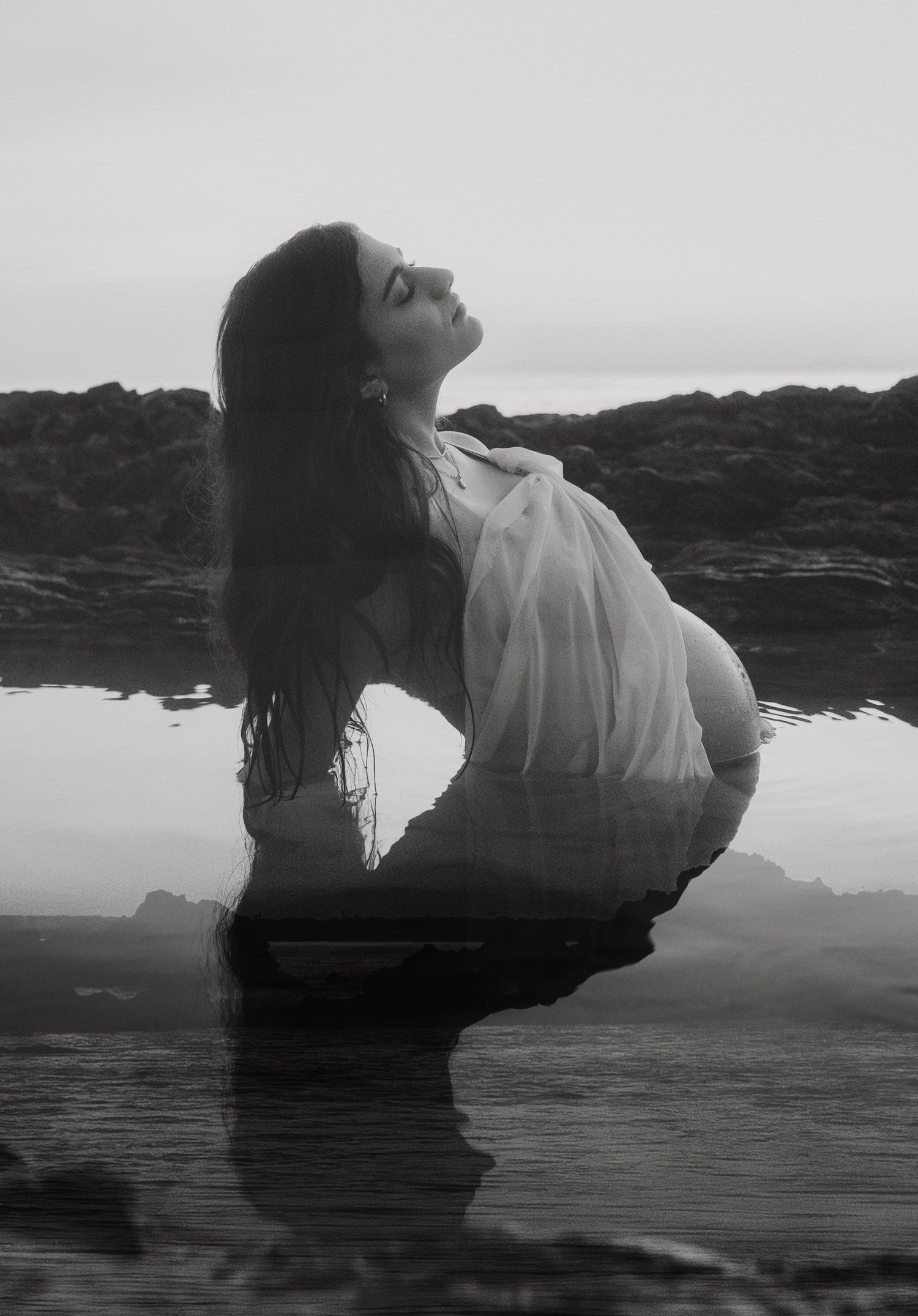 Monochrome artistic portrait series showing reflections in coastal waters.