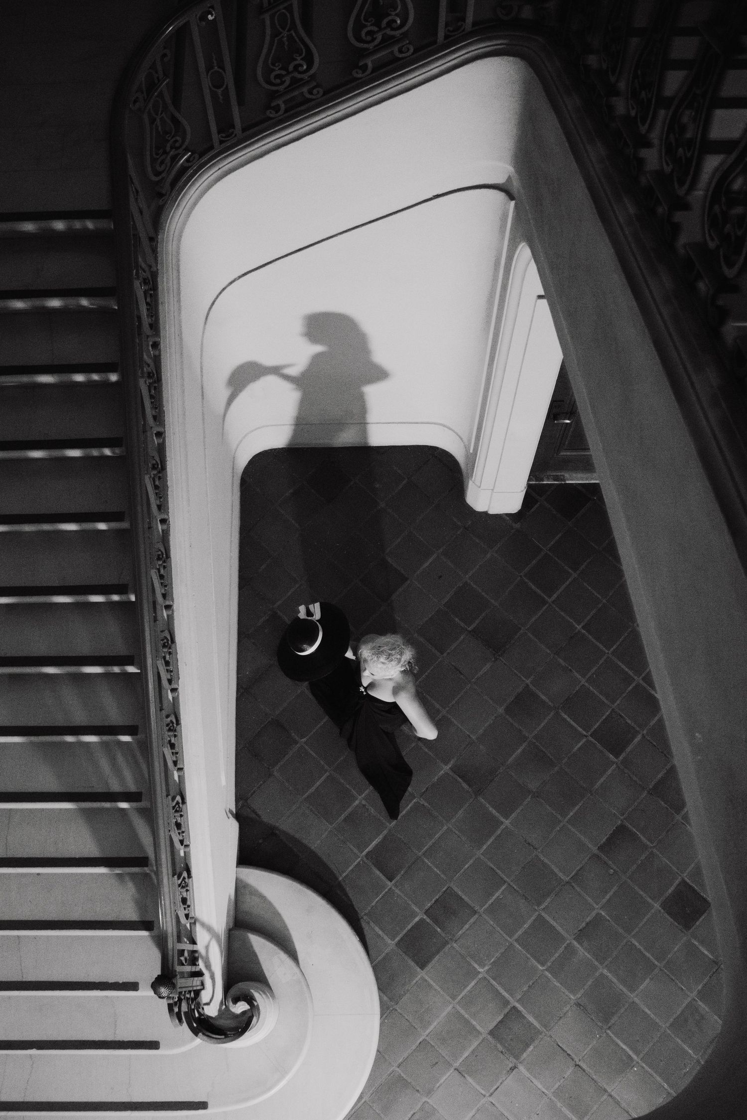High contrast black and white sequence showing dramatic shadows and angles in an architectural space.