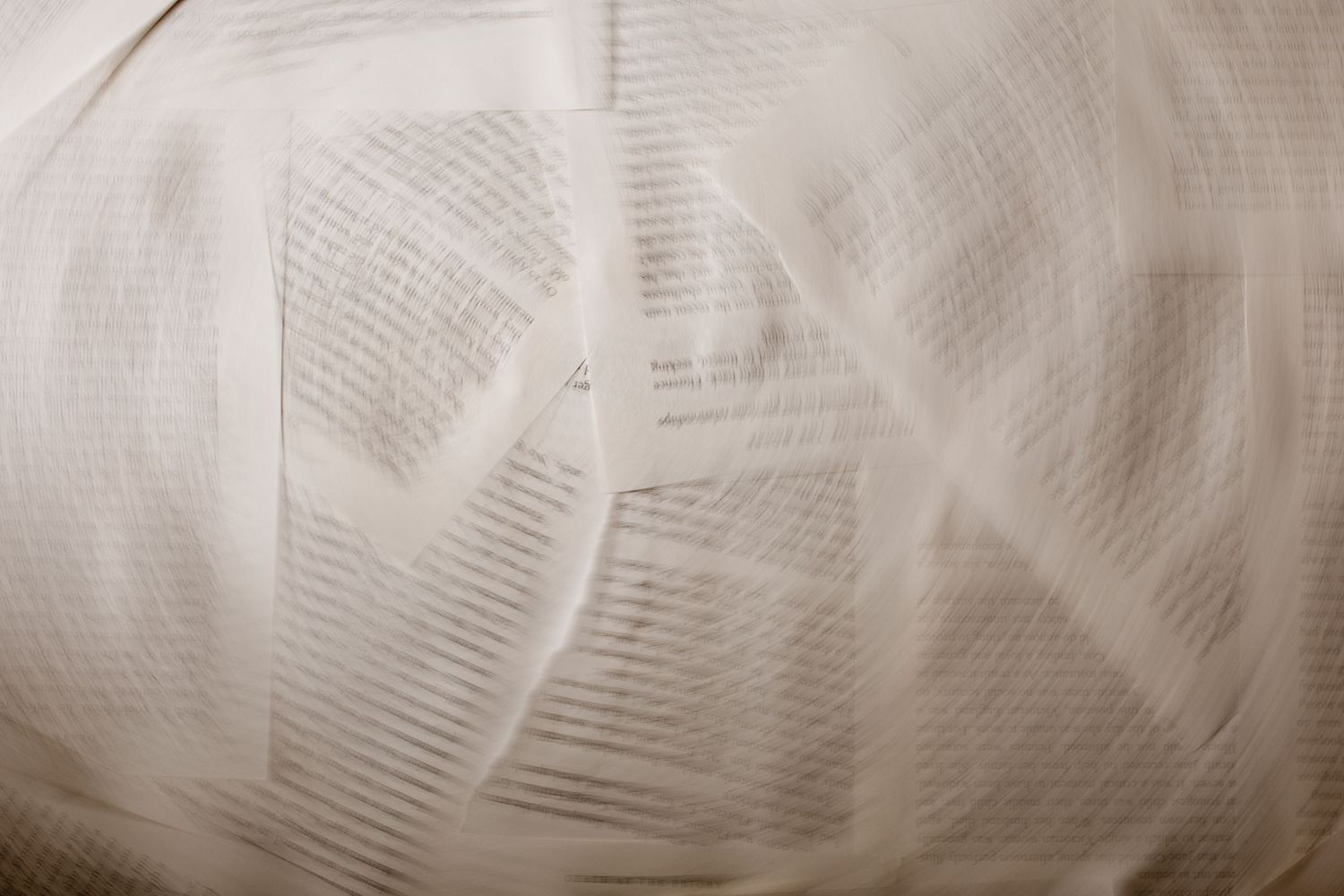 Crumpled white paper texture creates an abstract background pattern with soft shadows and folds.