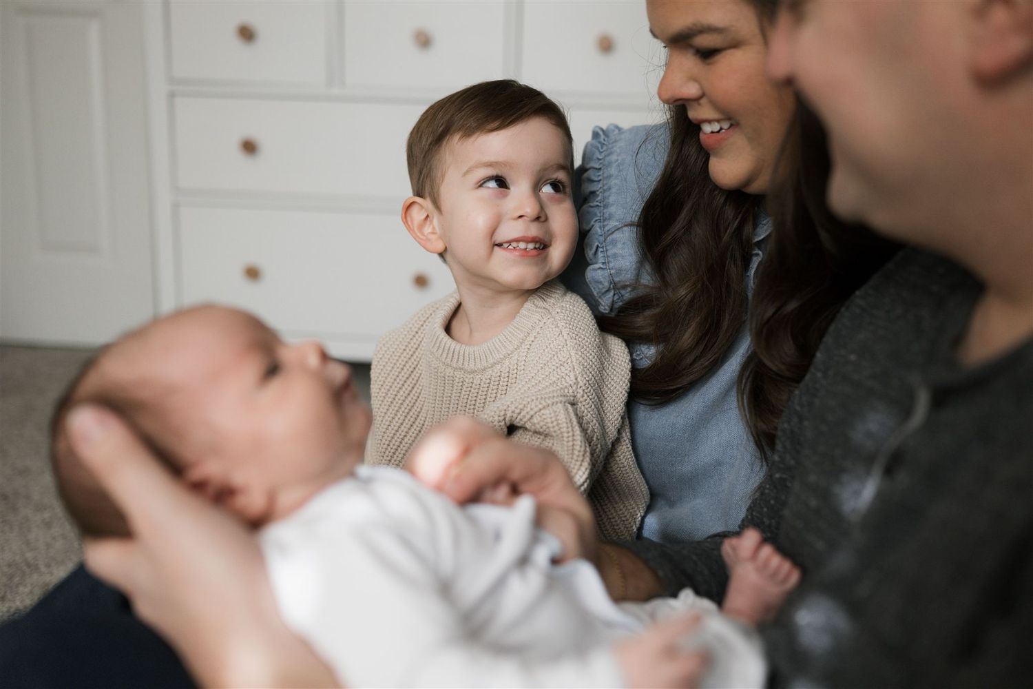 A series of candid moments showing people interacting and smiling together in a warm indoor setting.