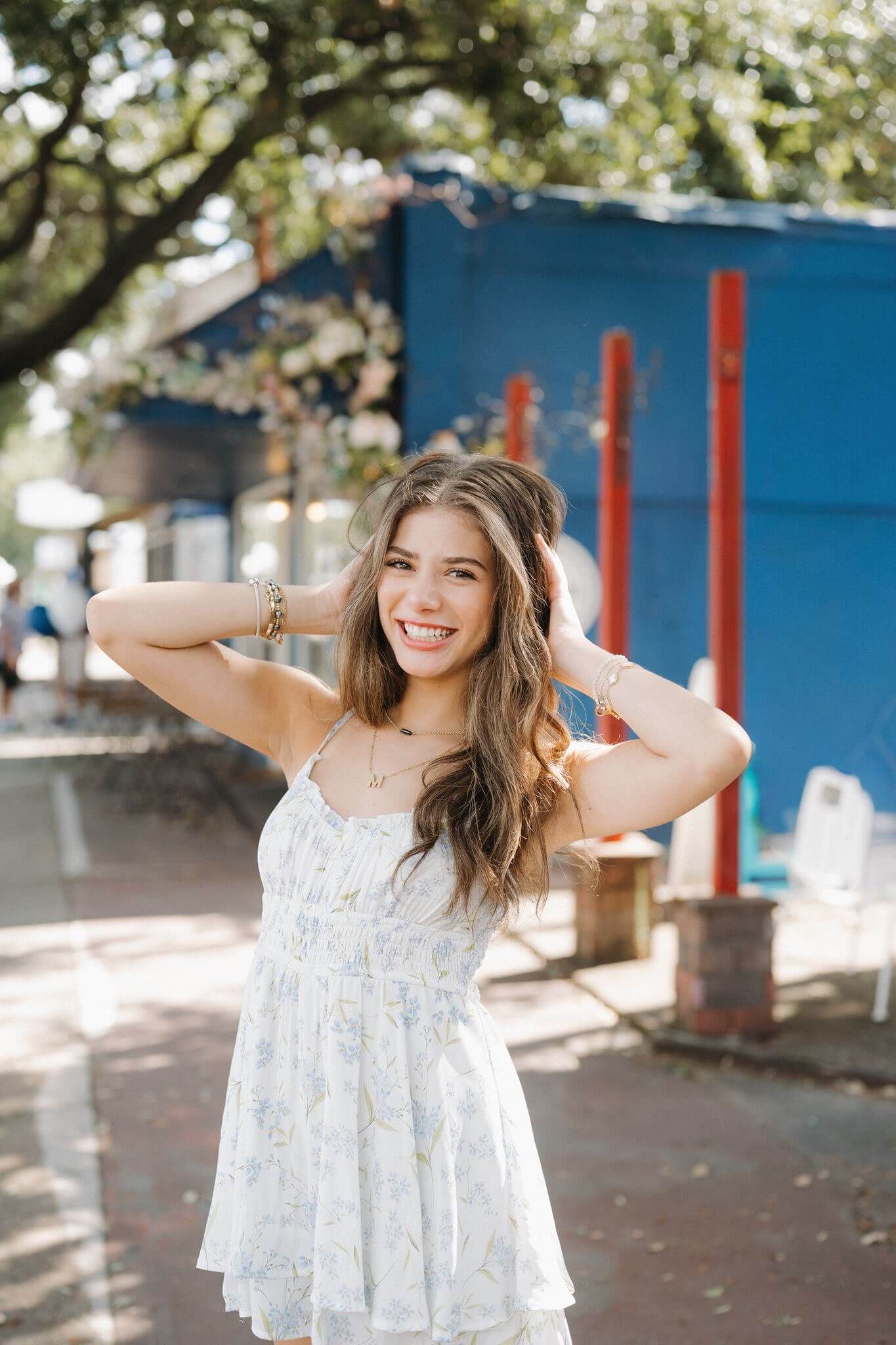 College Park High School senior girl posing in downtown Tomball Tx
