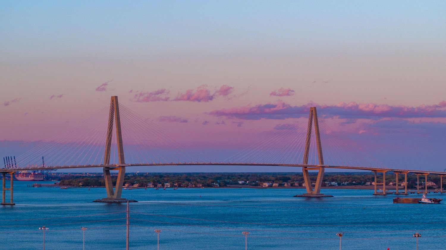 A unique bridge structure with a beautiful sunset in the background demonstrating the high quality aerial images of Jeff