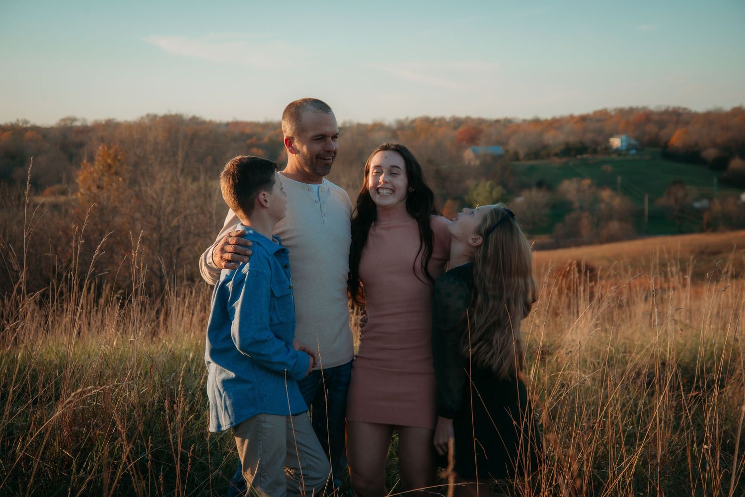 Outdoor family session at golden hour on a Kentucky farm. Natural light, candid moments, and heartfelt connection captured beautifully.