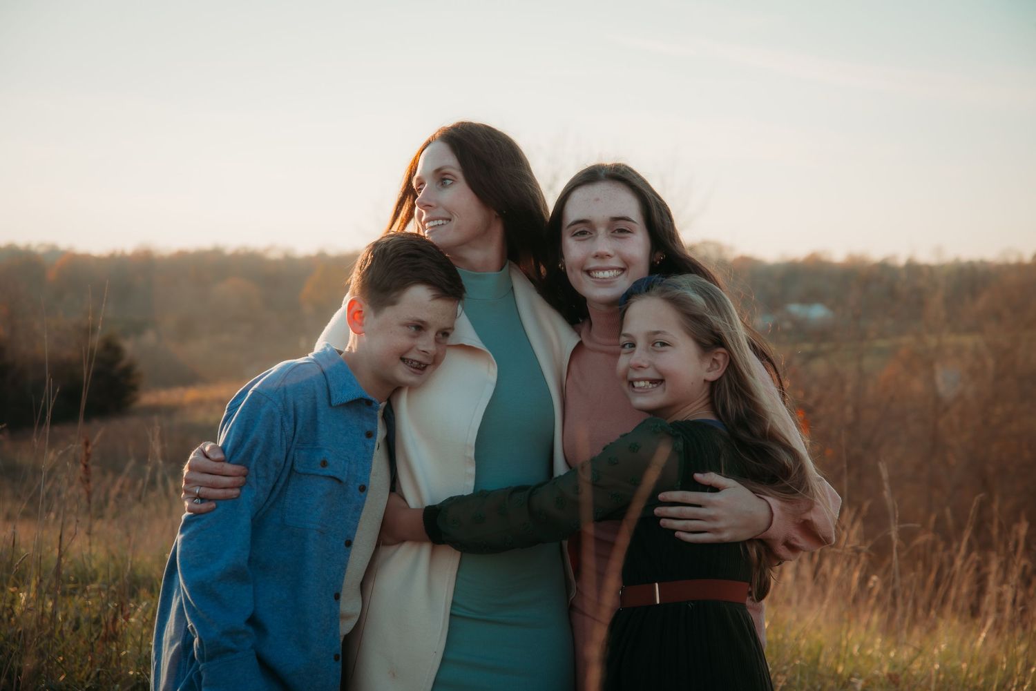 Outdoor family session at golden hour on a Kentucky farm. Natural light, candid moments, and heartfelt connection captured beautifully.