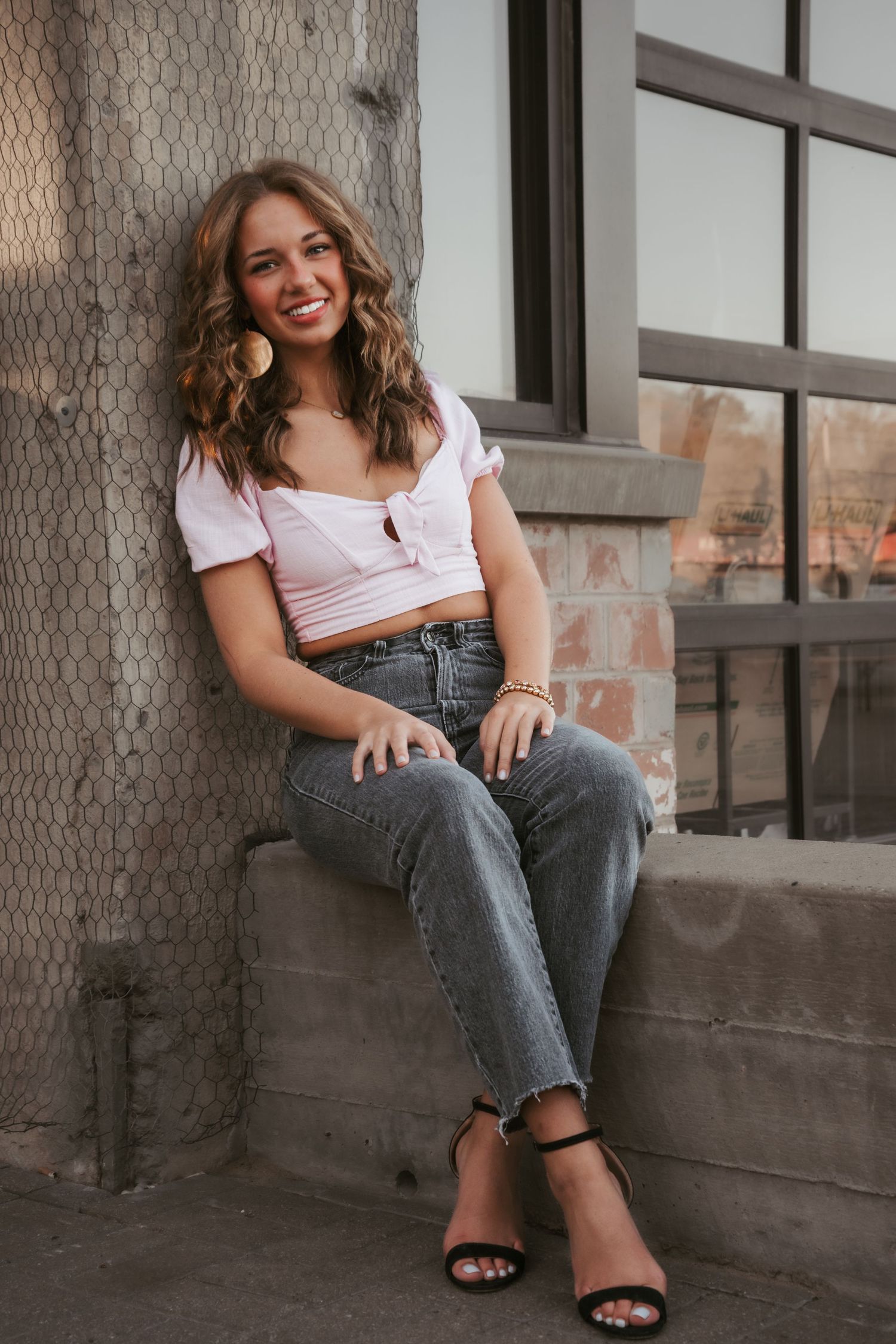 Urban senior portrait with bold style and natural light. Kentucky lifestyle photographer captures personality and city vibes.