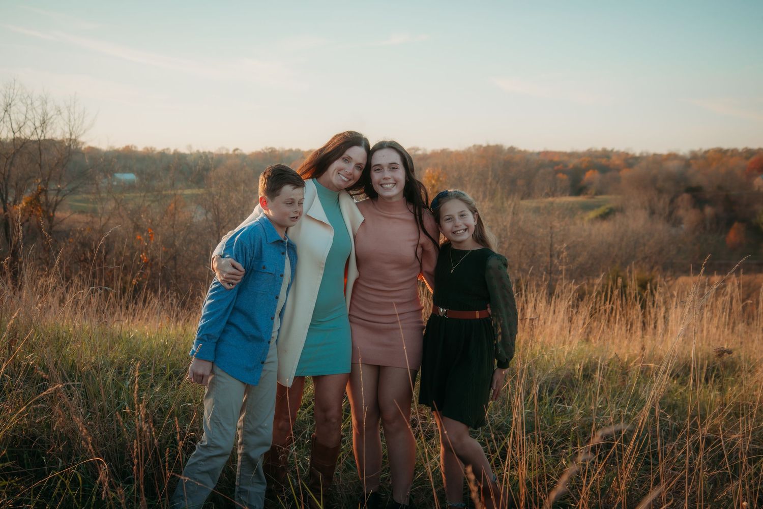 Outdoor family session at golden hour on a Kentucky farm. Natural light, candid moments, and heartfelt connection captured beautifully.