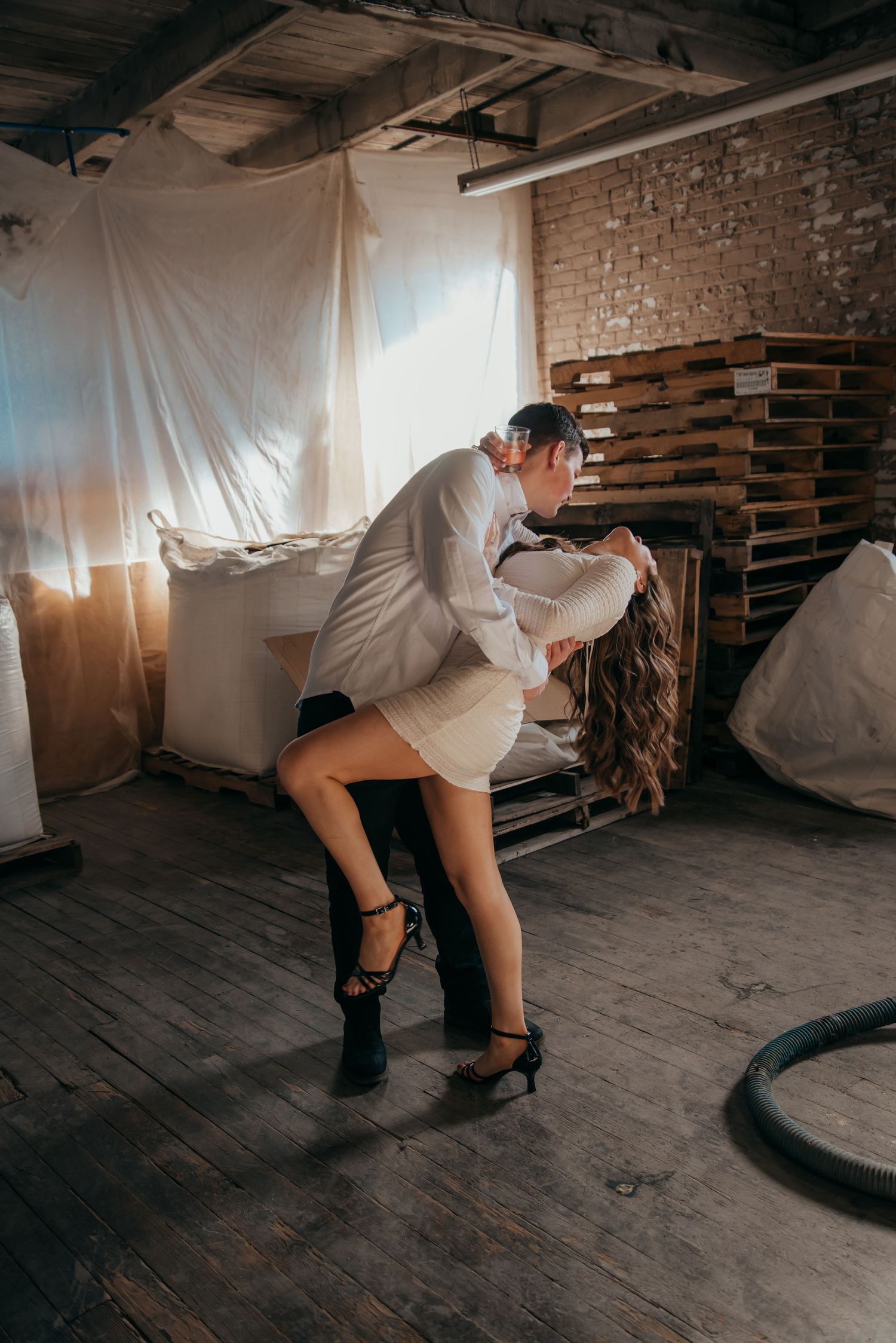 Indoor engagement photo with natural light. Kentucky lifestyle photographer captures candid love and cozy, heartfelt connection.