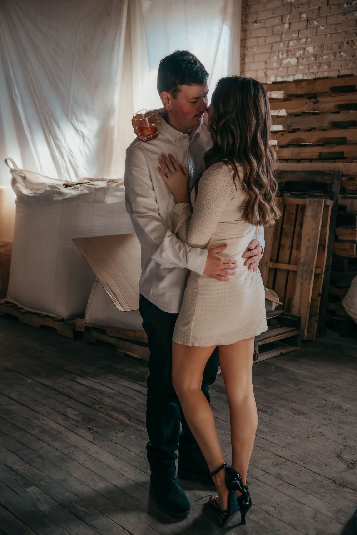 Indoor engagement photo with natural light. Kentucky lifestyle photographer captures candid love and cozy, heartfelt connection.