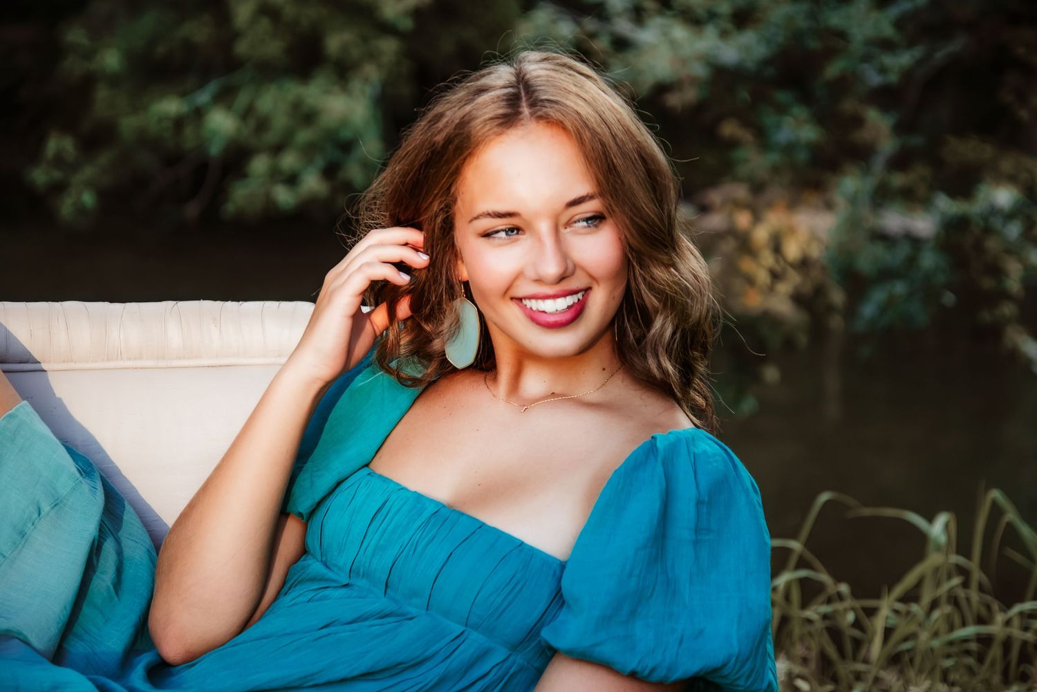 Playful senior portrait in nature at golden hour. Kentucky lifestyle photographer captures joy, personality, and warm natural light.