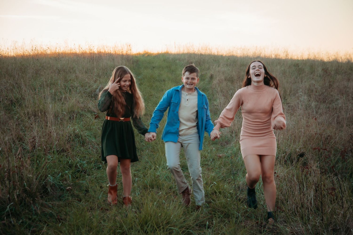 Outdoor family session at golden hour on a Kentucky farm. Natural light, candid moments, and heartfelt connection captured beautifully.