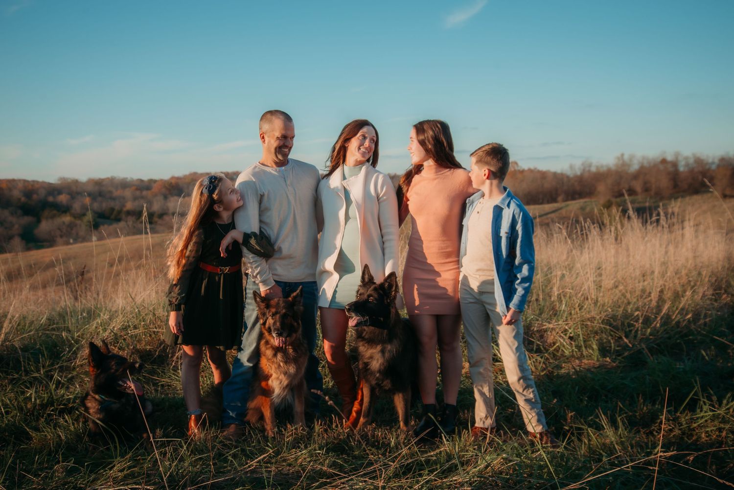 Outdoor family session at golden hour on a Kentucky farm. Natural light, candid moments, and heartfelt connection captured beautifully.