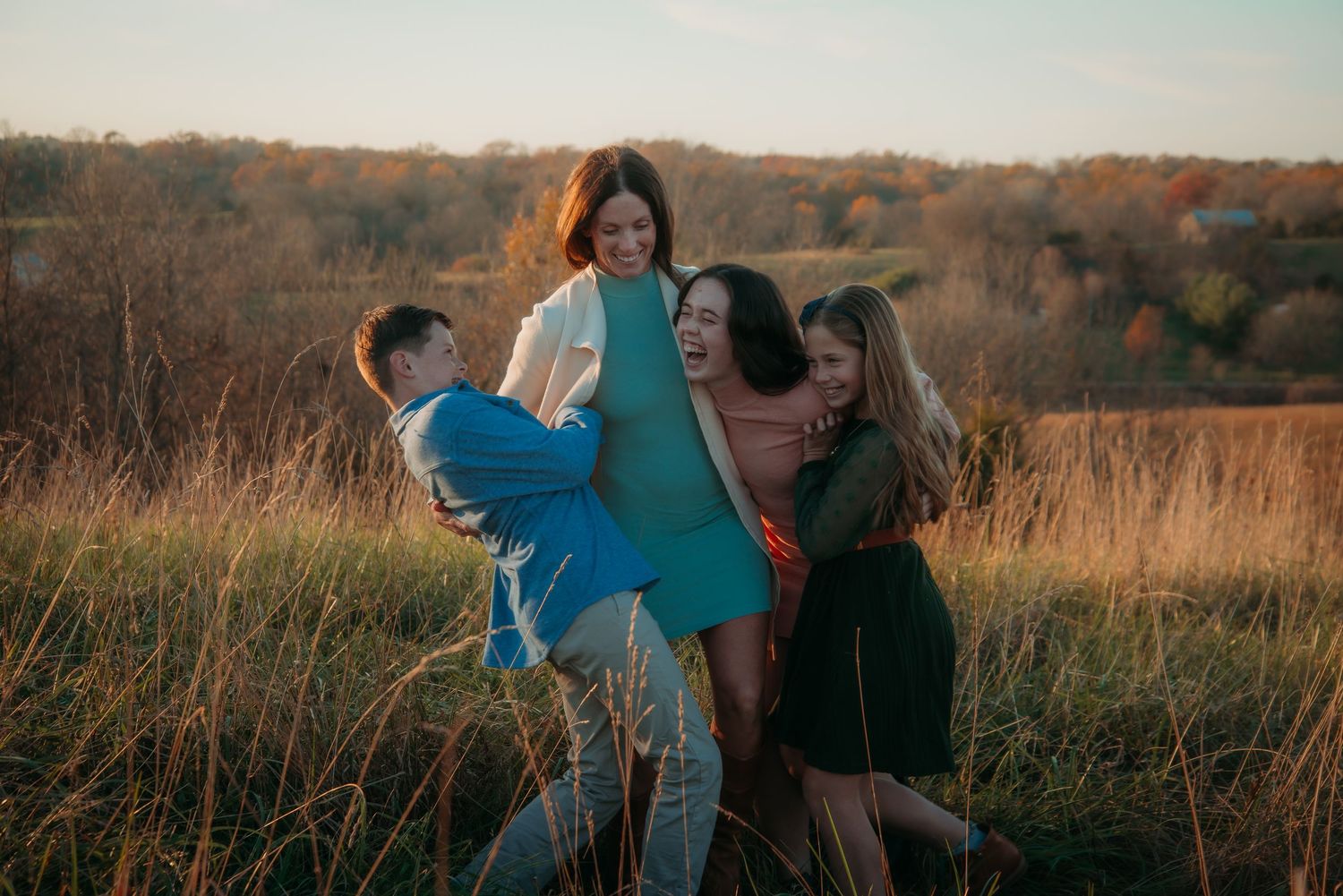 Outdoor family session at golden hour on a Kentucky farm. Natural light, candid moments, and heartfelt connection captured beautifully.