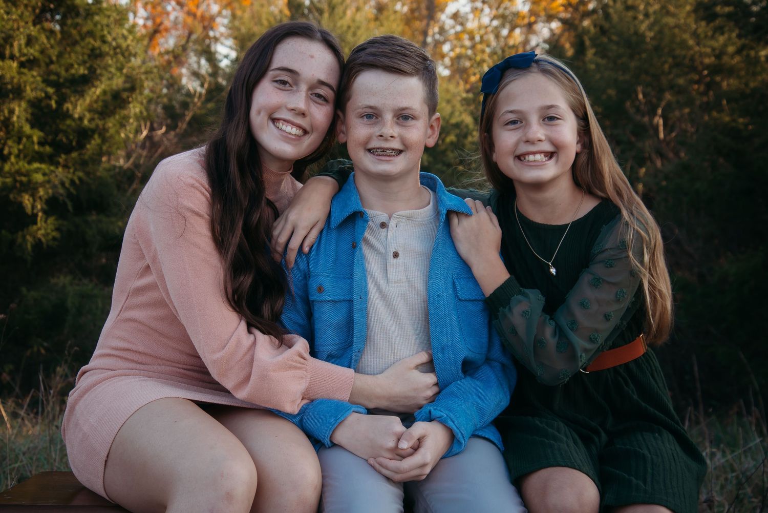 Outdoor family session at golden hour on a Kentucky farm. Natural light, candid moments, and heartfelt connection captured beautifully.