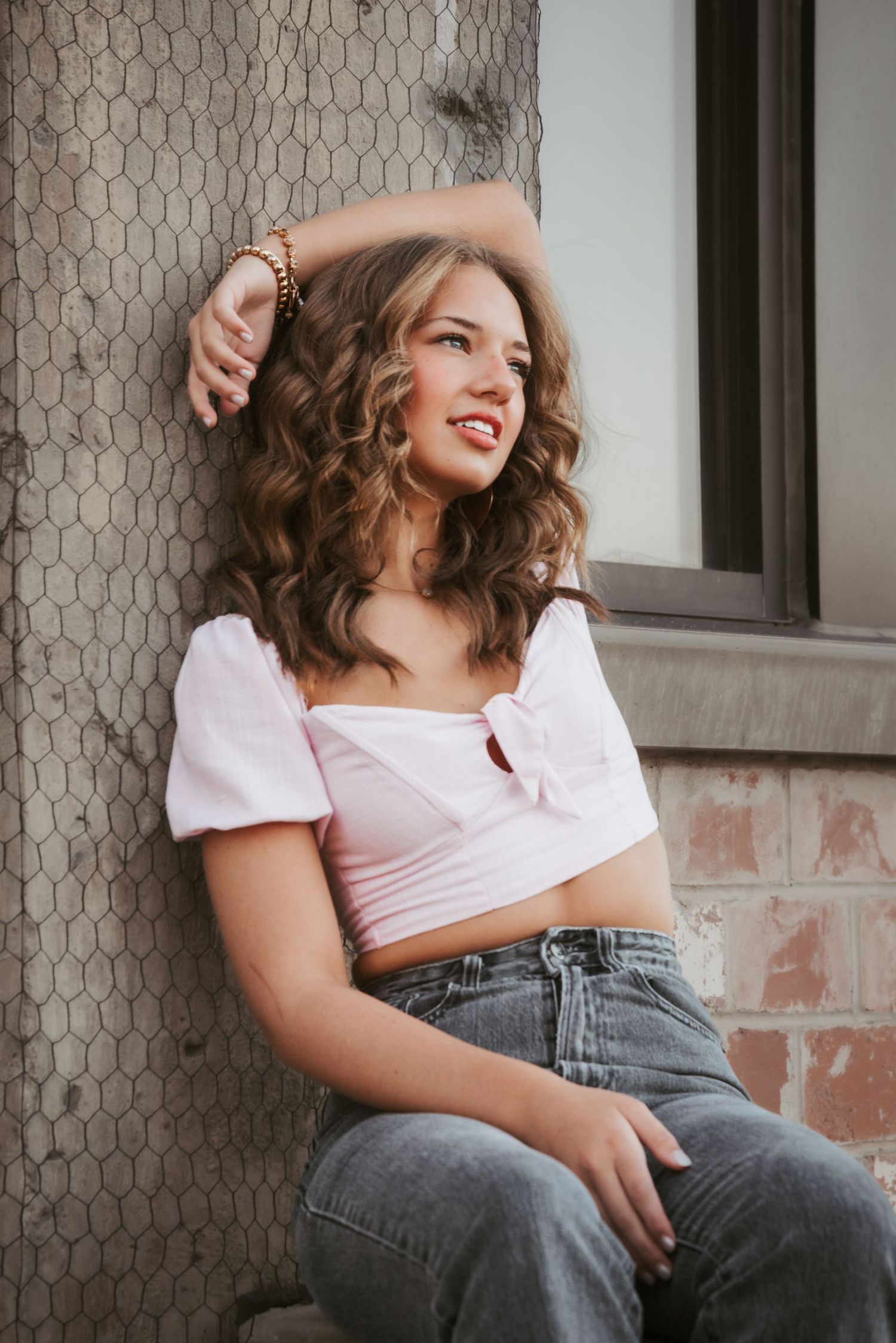 Urban senior portrait with bold style and natural light. Kentucky lifestyle photographer captures personality and city vibes.