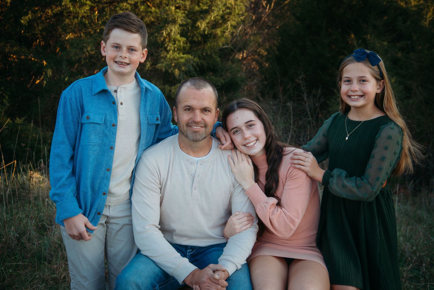 Outdoor family session at golden hour on a Kentucky farm. Natural light, candid moments, and heartfelt connection captured beautifully.