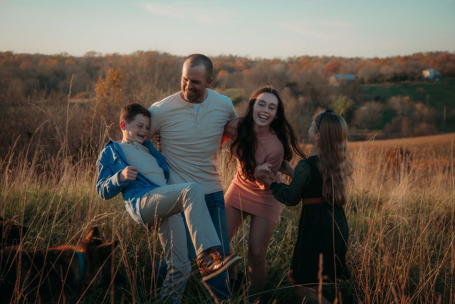 Outdoor family session at golden hour on a Kentucky farm. Natural light, candid moments, and heartfelt connection captured beautifully.