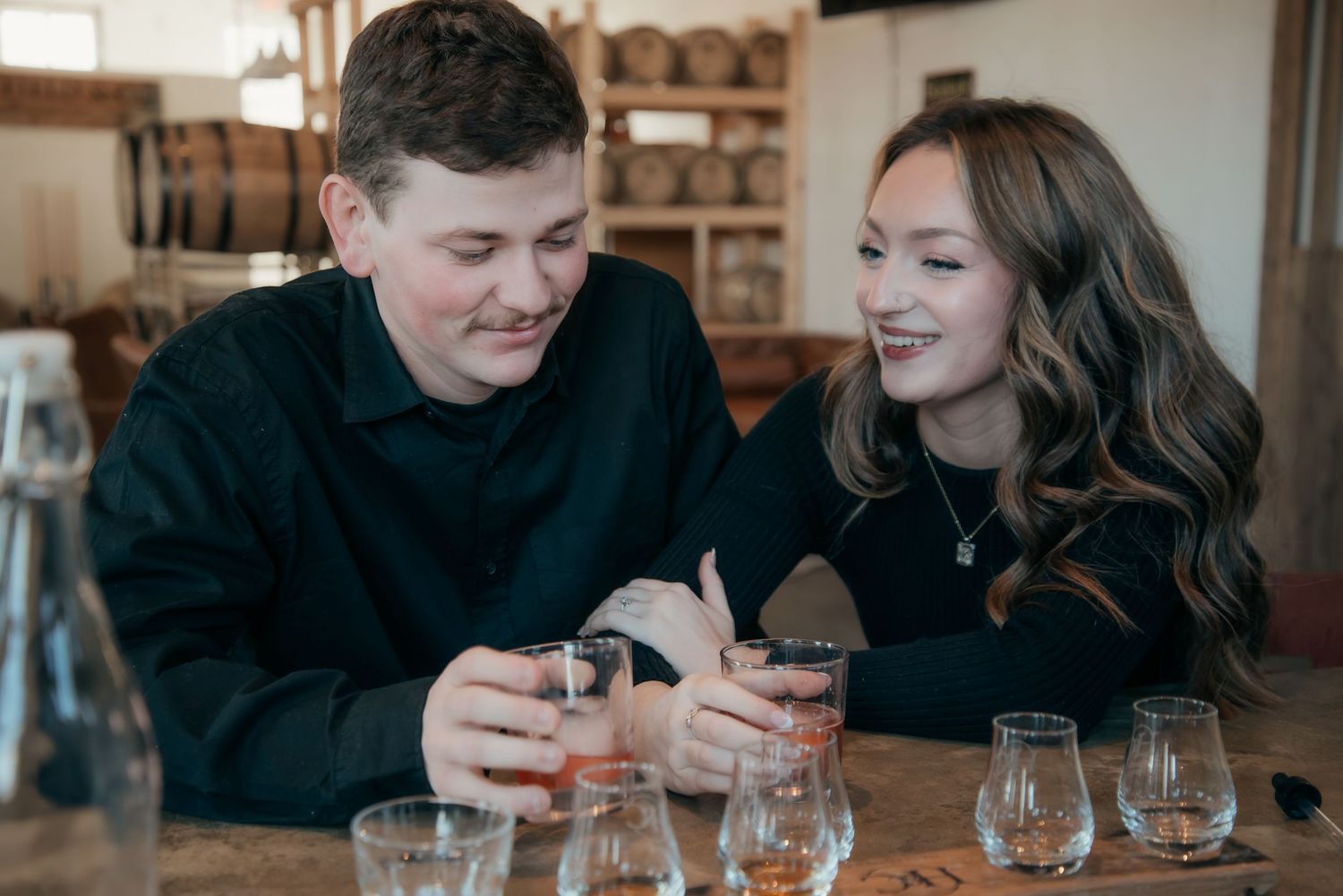 Indoor engagement photo with natural light. Kentucky lifestyle photographer captures candid love and cozy, heartfelt connection.
