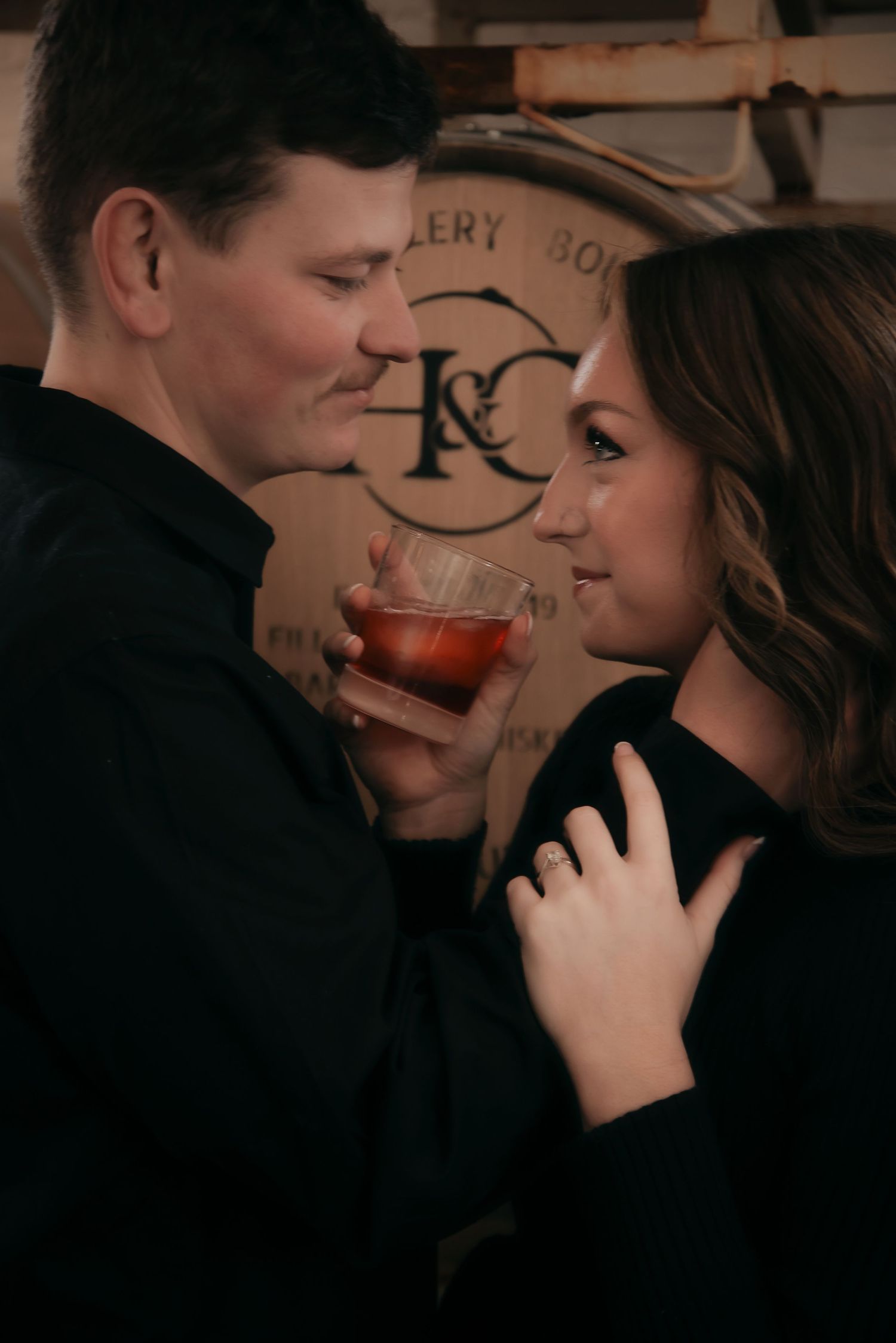 Indoor engagement photo with natural light. Kentucky lifestyle photographer captures candid love and cozy, heartfelt connection.