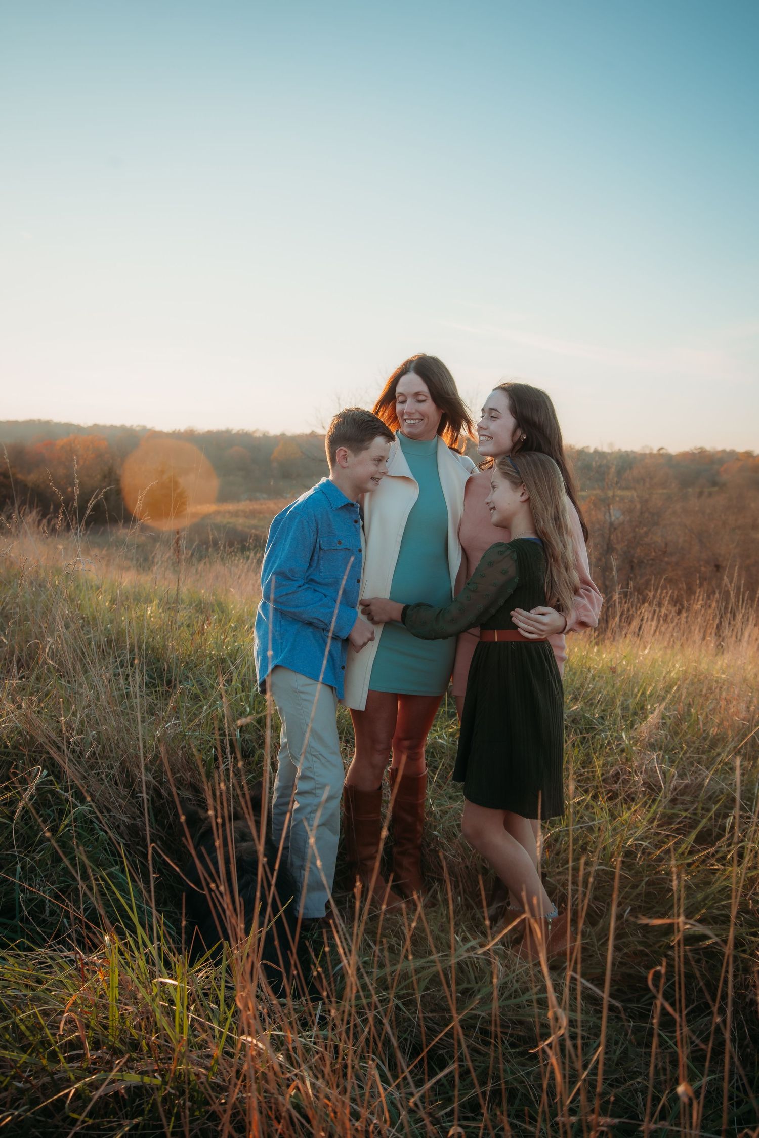 Outdoor family session at golden hour on a Kentucky farm. Natural light, candid moments, and heartfelt connection captured beautifully.