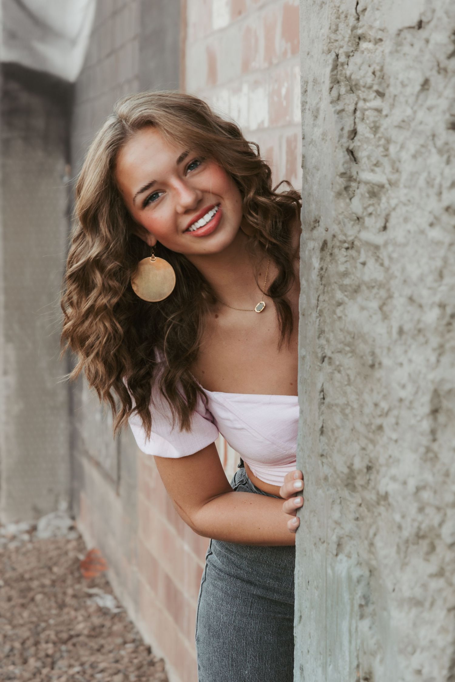 Urban senior portrait with bold style and natural light. Kentucky lifestyle photographer captures personality and city vibes.