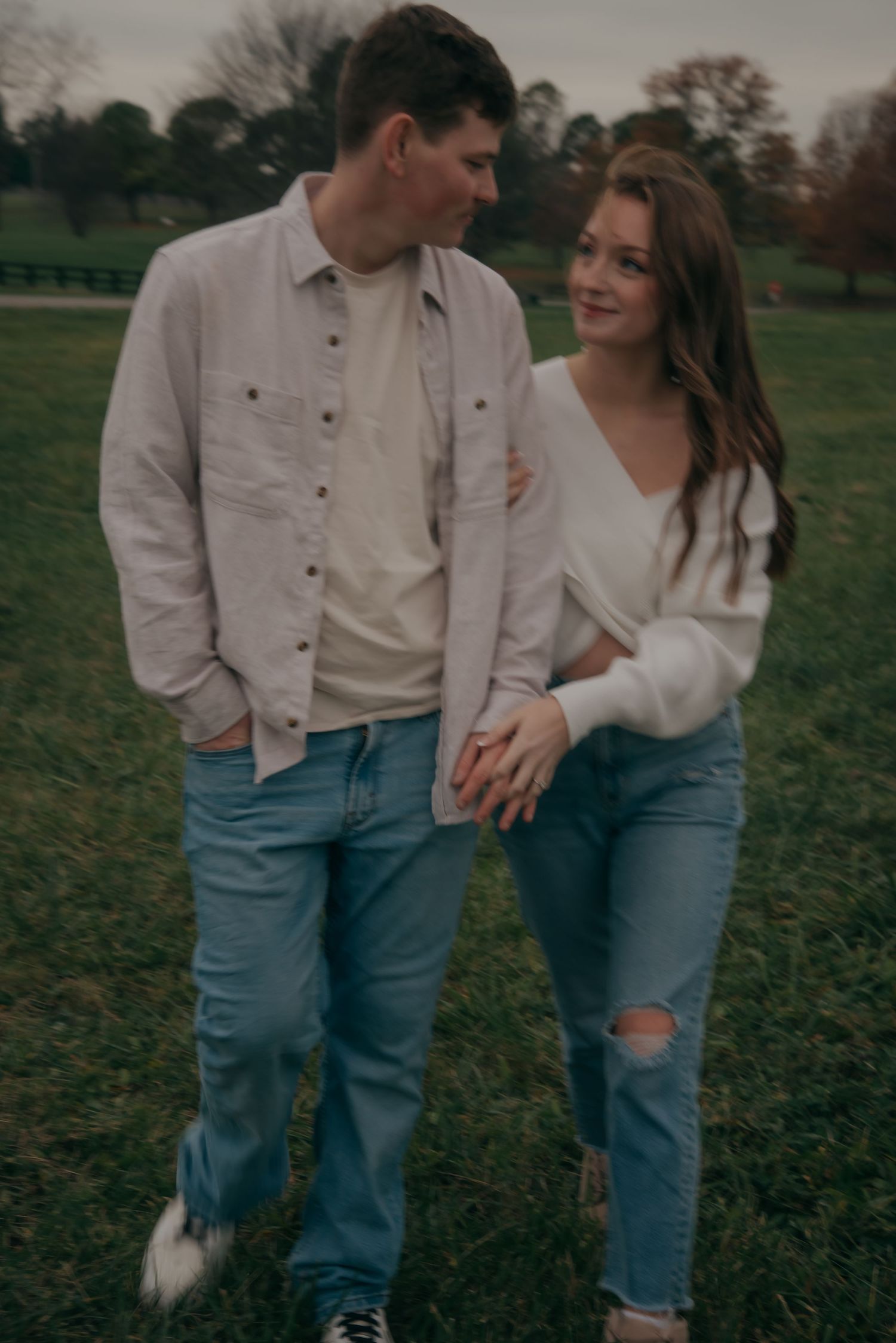 Outdoor engagement photo in natural light. Kentucky lifestyle photographer captures candid love and joyful connection.