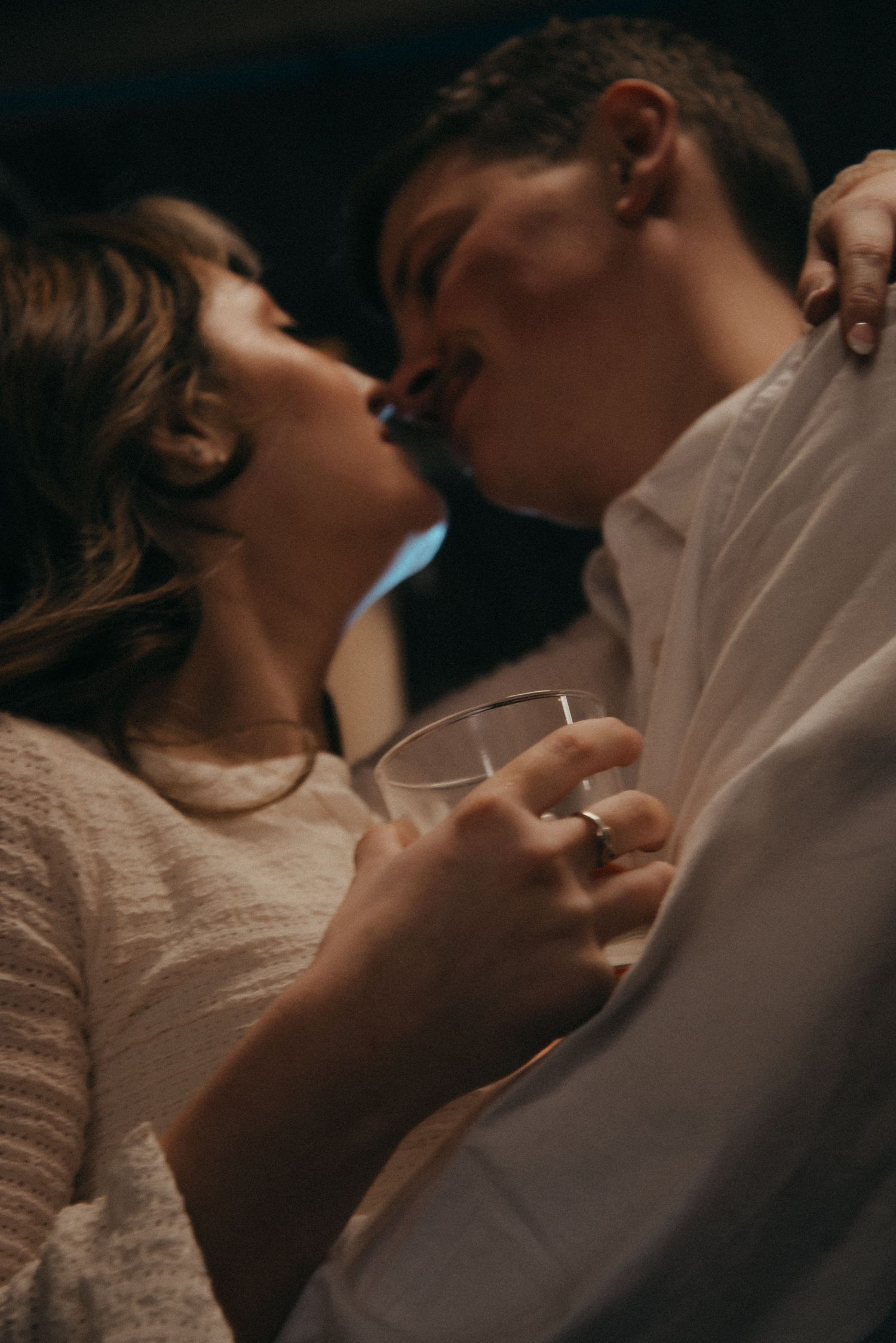 Indoor engagement photo with natural light. Kentucky lifestyle photographer captures candid love and cozy, heartfelt connection.