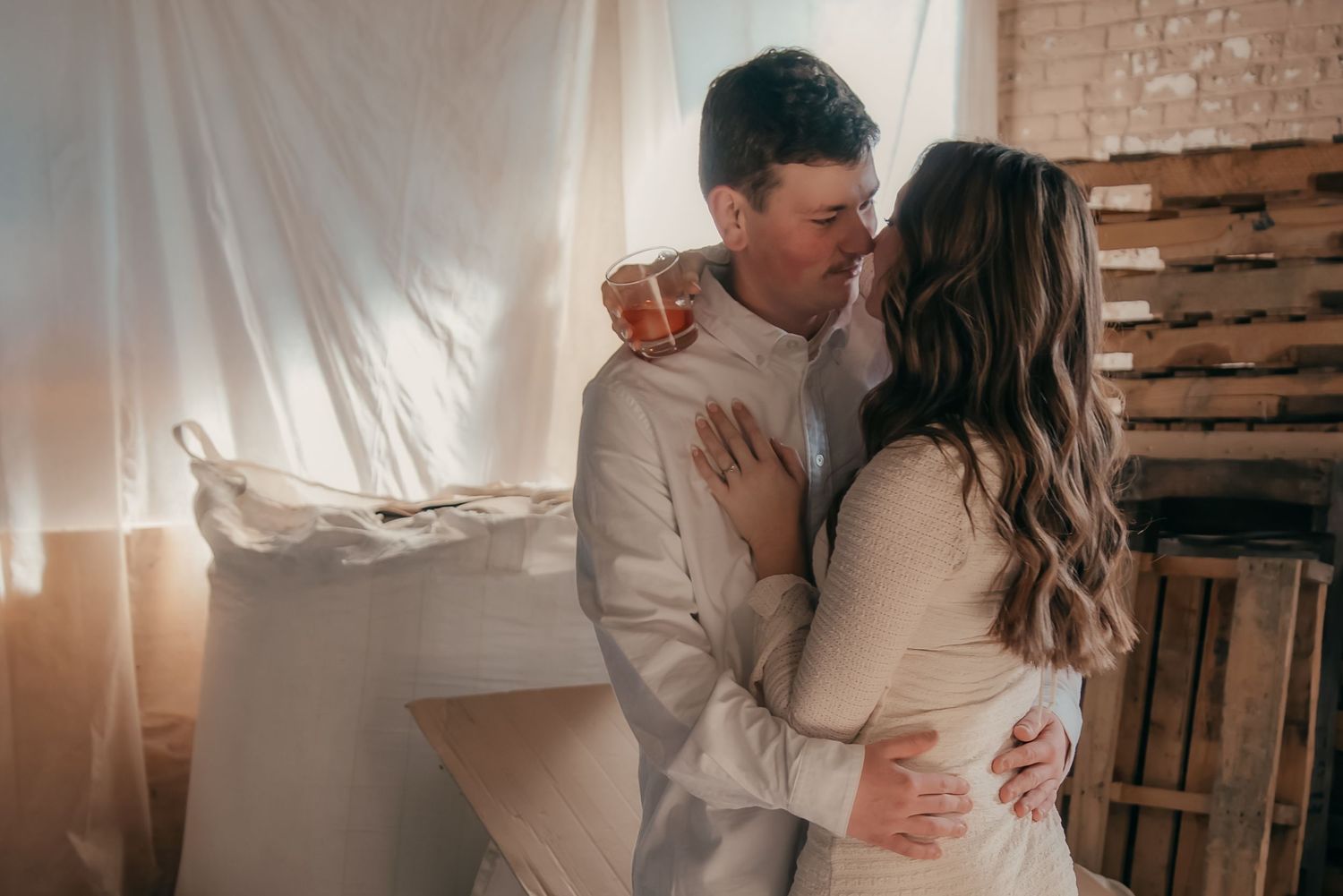 Indoor engagement photo with natural light. Kentucky lifestyle photographer captures candid love and cozy, heartfelt connection.