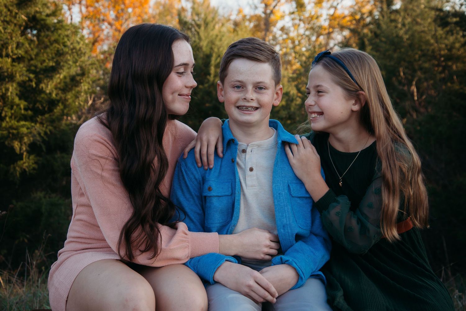 Outdoor family session at golden hour on a Kentucky farm. Natural light, candid moments, and heartfelt connection captured beautifully.