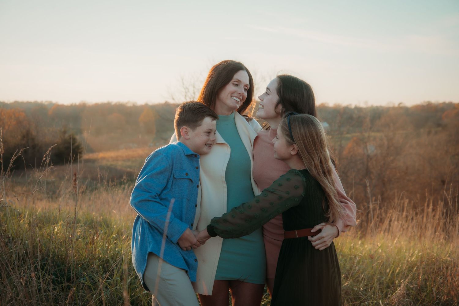 Outdoor family session at golden hour on a Kentucky farm. Natural light, candid moments, and heartfelt connection captured beautifully.