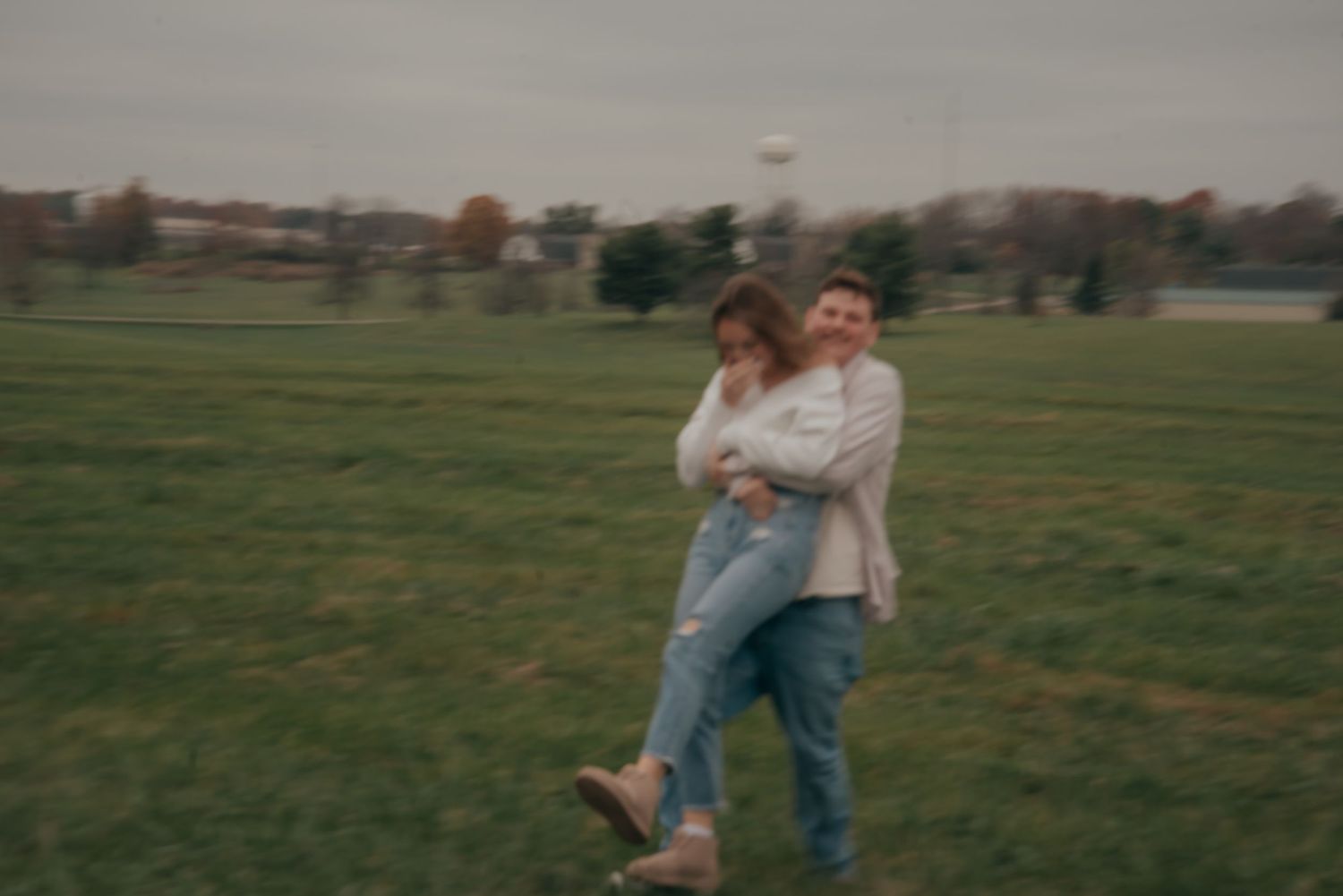 Outdoor engagement photo in natural light. Kentucky lifestyle photographer captures candid love and joyful connection.