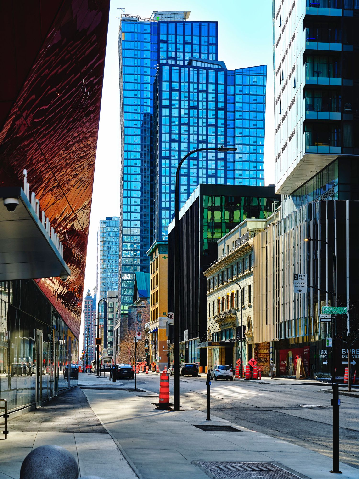 Modern glass office buildings and empty streets in an urban downtown business district.