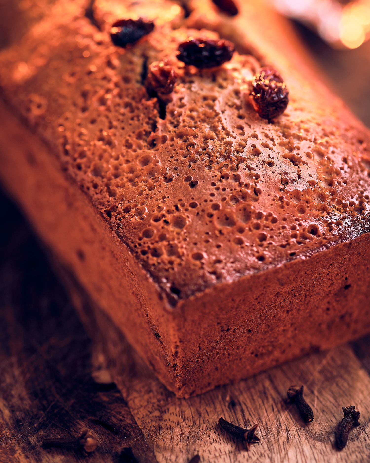 Close-up macro shot of a chocolate brownie texture showing its porous surface.
