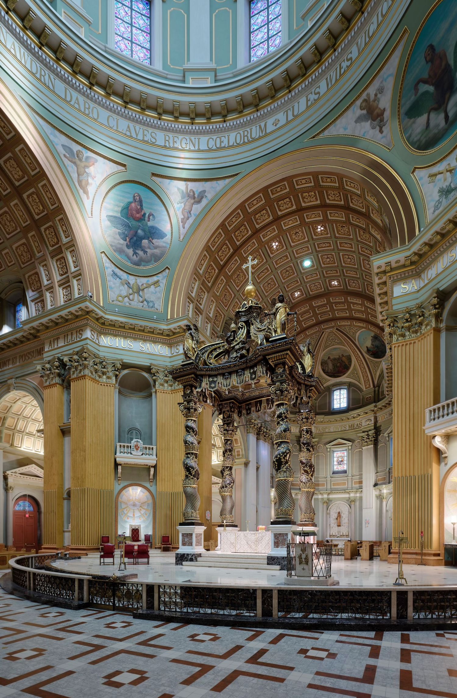 Ornate Catholic cathedral interior featuring gilded baldachin altar, dome ceiling with murals, and marble floors.