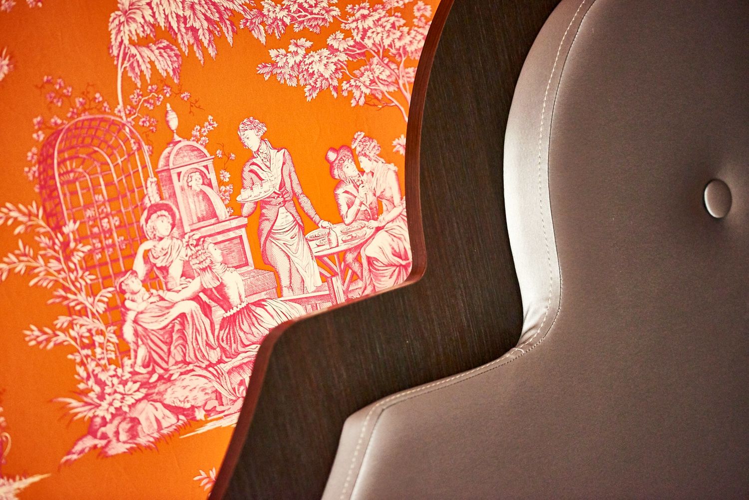 Orange decorative wall with artistic pattern in modern interior space.