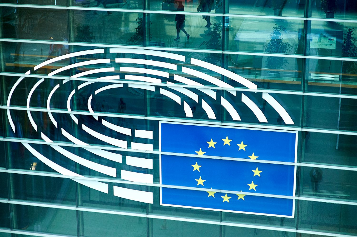 European Parliament building exterior with EU logo and architectural details.