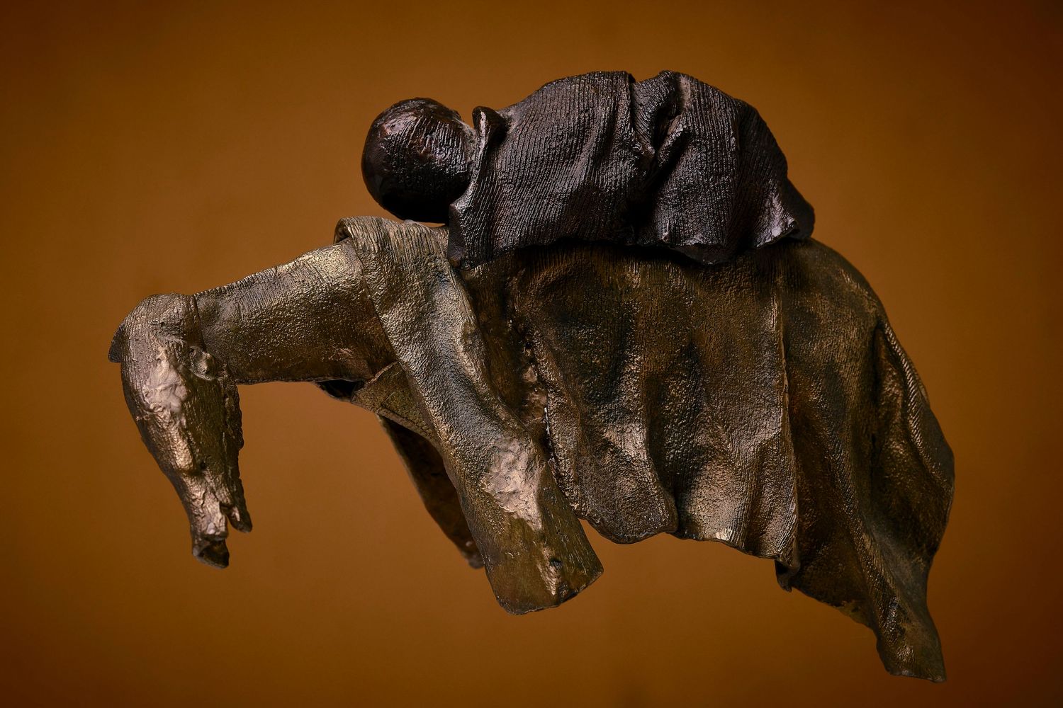 Bronze or metal sculpture of a running horse shown in sequential motion.