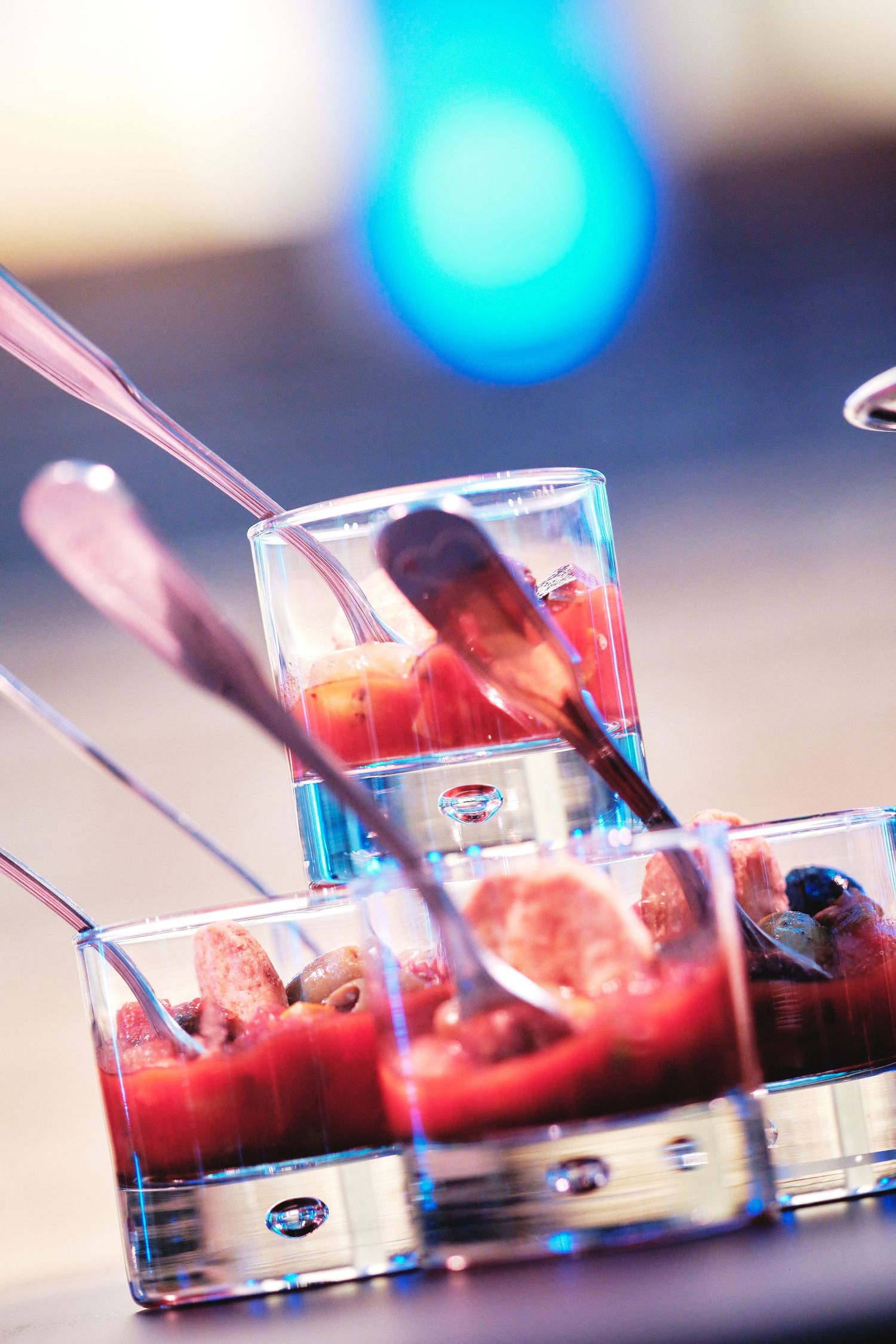 Close-up sequence of laboratory slides with red liquid samples being analyzed.