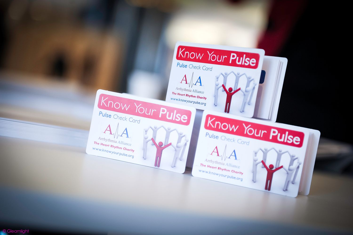 'Know Your Pulse' branded materials displayed on a table.