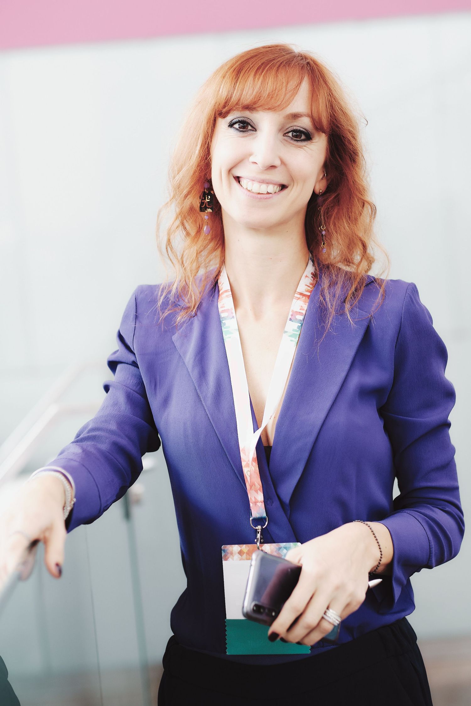 Professional woman in purple blazer shown in sequence of dynamic poses.