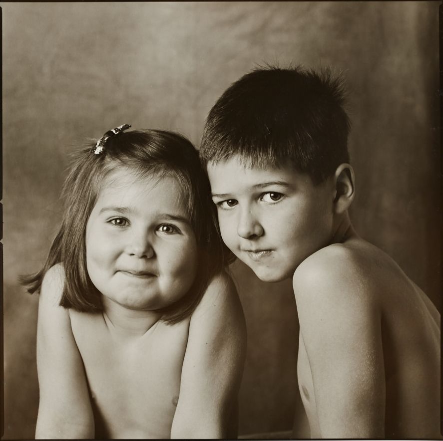 Black and white portrait series showing close-up facial expressions in dramatic lighting.